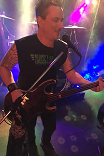 jeff wagner playing bass and singing- friendly jesture